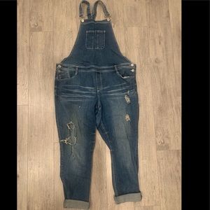 Distressed denim overalls